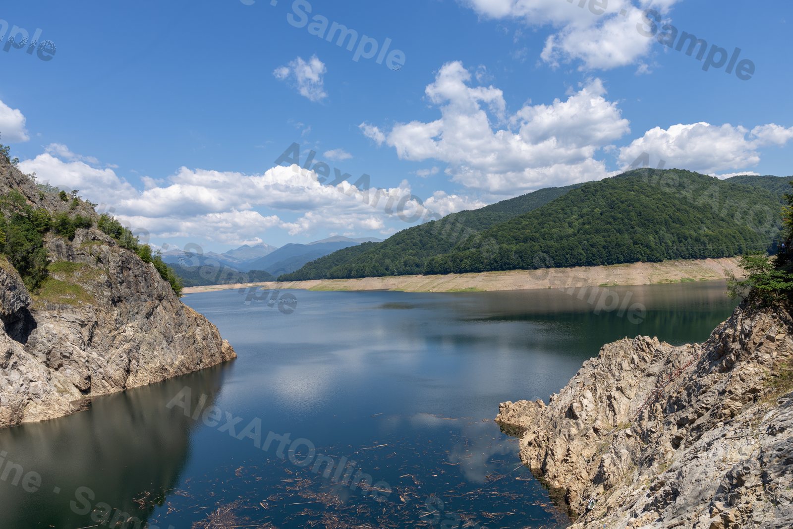 A still mountain lake framed by rocky cliffs in the Carpathians